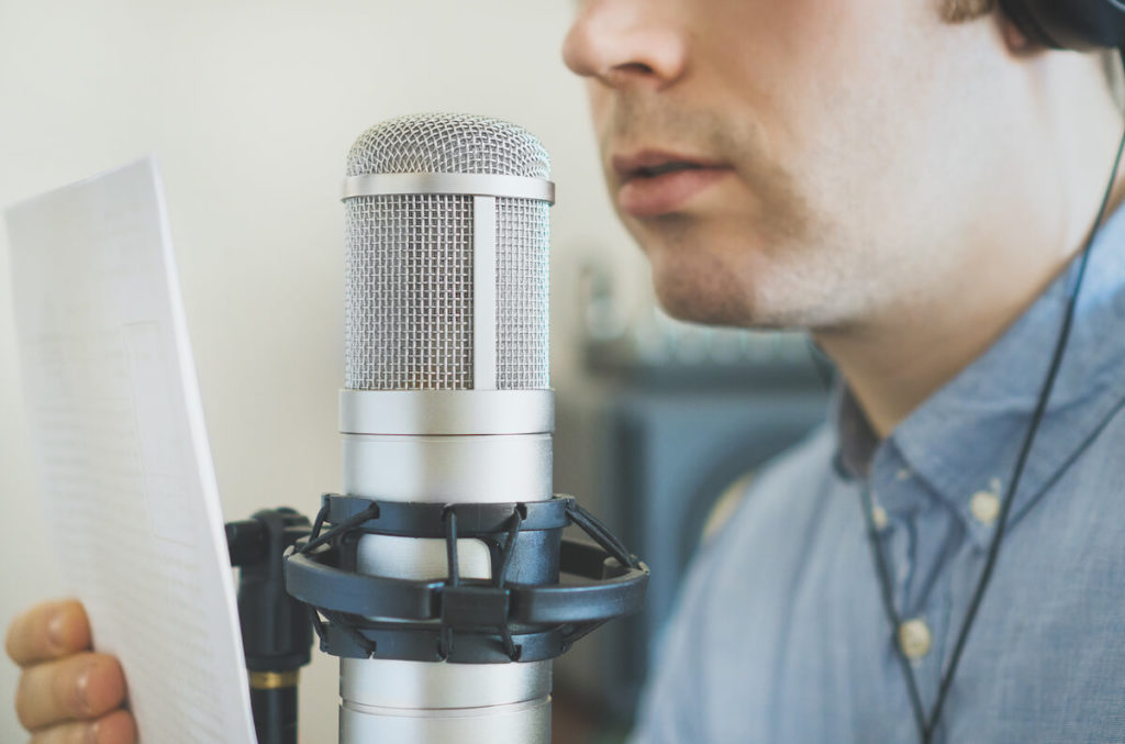 Radio sales: Man reading into microphone