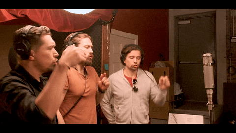 three guys singing radio spots in a studio