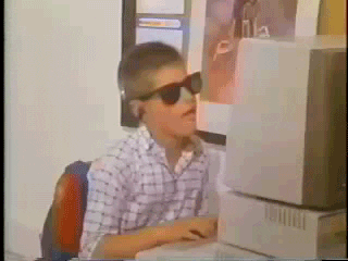 How much do radio ads cost: boy singing while using a computer GIF