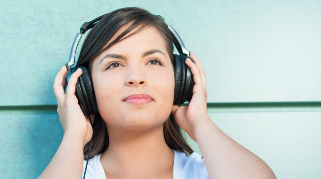 Audio advertising: woman holding her headphones