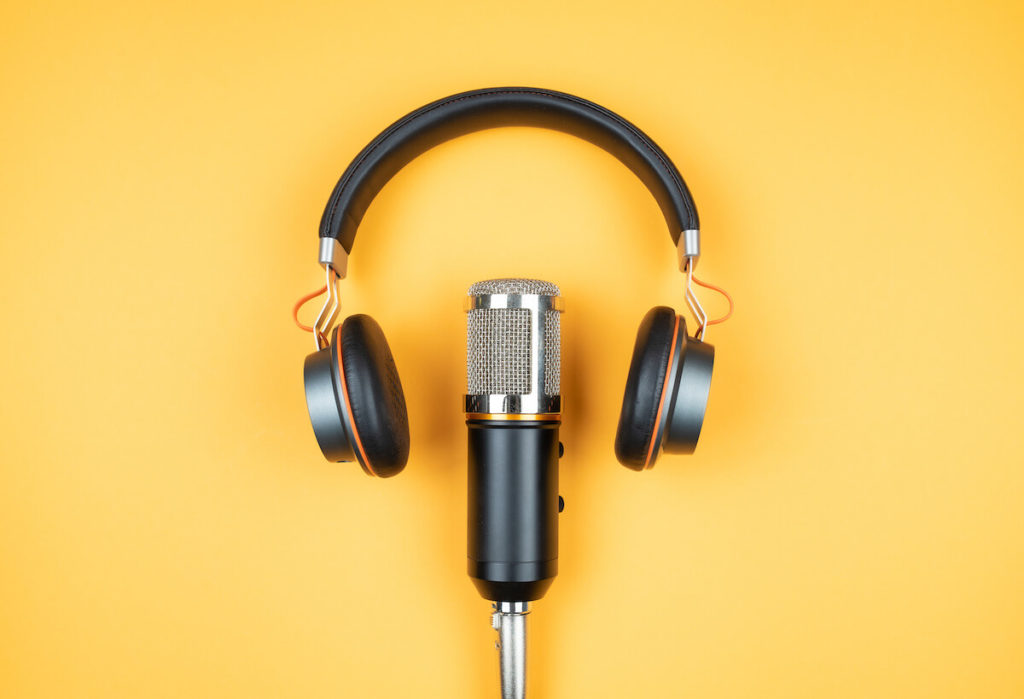 Podcast ad examples: A pair of headphones and a microphone