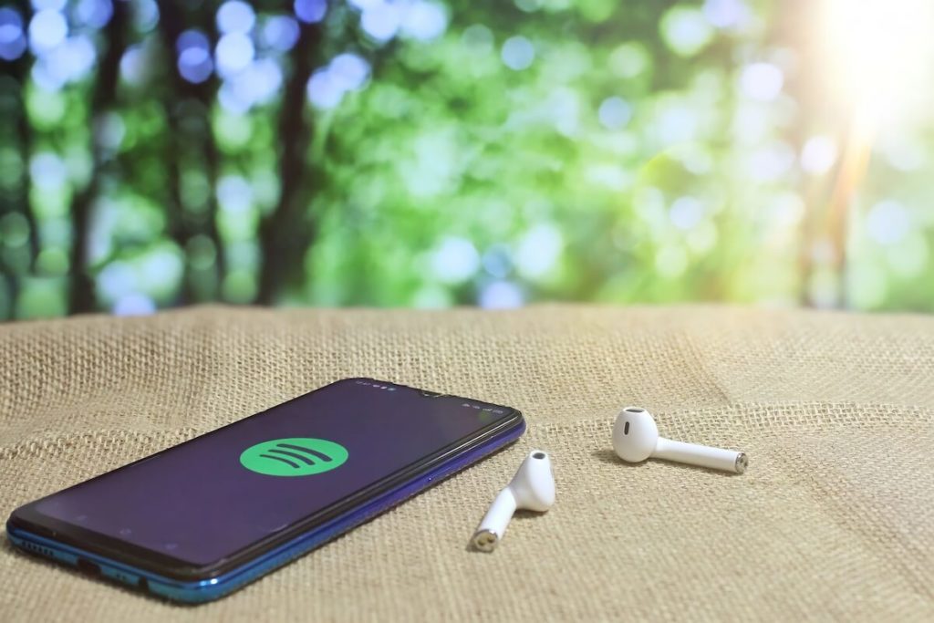 Spotify advertising: Airpods and Spotify on a mobile phone