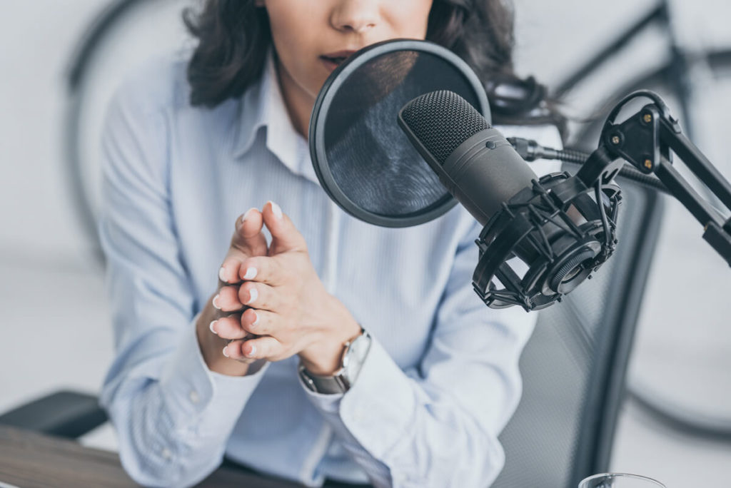 Radio Advertising Bureau: broadcaster speaking into a microphone
