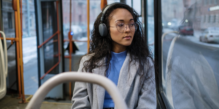 woman-on-bus-wearing-headphones